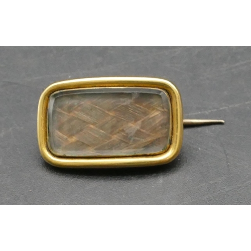 310 - A 19th Century gold mourning brooch inscribed to reverse and dated 1829, 2.2cm wide, 4.5 grams gross