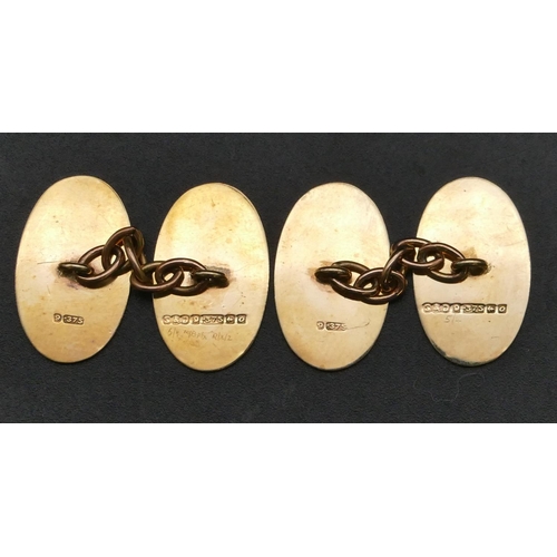 313 - A pair of 9ct gold gentlemen's oval cufflinks with engine turned decoration, 4.5 grams