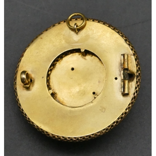 316 - A gold circular brooch/pendant with raised ball and linked decoration, 3.5cm diameter, 9.5 grams