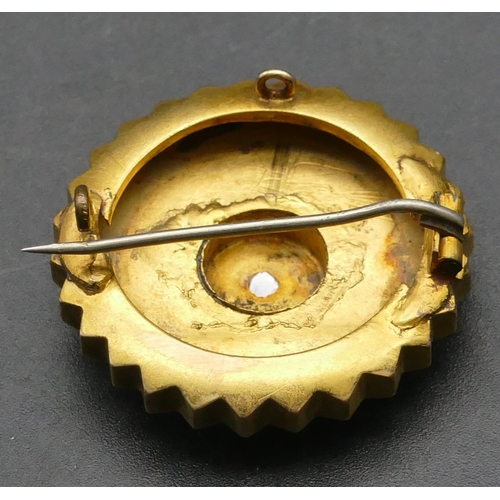 317 - A high carat gold round scalloped shaped brooch inset with rough cut diamond to centre, 3cm diameter... 