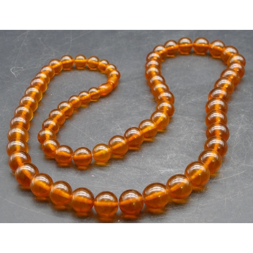 319 - An amber style bead necklace