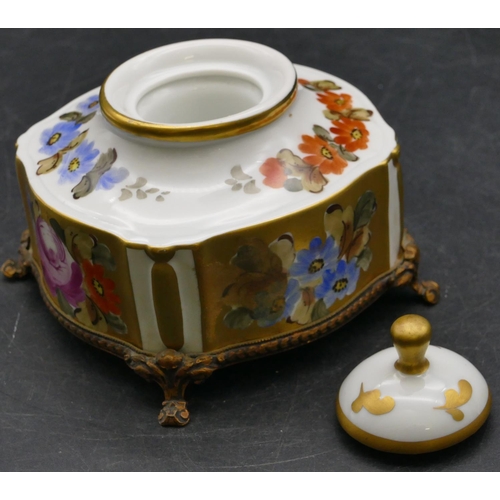 32 - A Limoges scallop shaped inkwell with cover on white and gilt ground with multicoloured floral and l... 