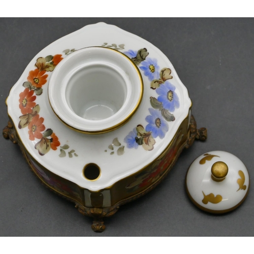 32 - A Limoges scallop shaped inkwell with cover on white and gilt ground with multicoloured floral and l... 