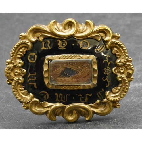 320 - A 19th Century rectangular scallop shaped mourning brooch with black and matted hair decoration and ... 