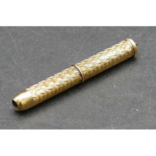 343 - A 9ct gold propelling toothpick with engine turned decoration, 7.5cm long open, 6.2 grams gross