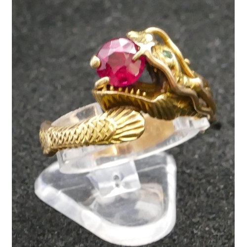 345 - A 14ct gold gent's ring in the form of a dragon, mounted with red stone, Size V/W, 6.5 grams gross