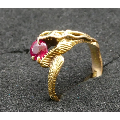 345 - A 14ct gold gent's ring in the form of a dragon, mounted with red stone, Size V/W, 6.5 grams gross