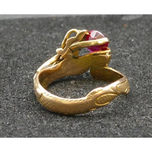 345 - A 14ct gold gent's ring in the form of a dragon, mounted with red stone, Size V/W, 6.5 grams gross