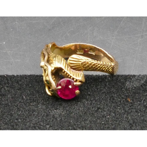 345 - A 14ct gold gent's ring in the form of a dragon, mounted with red stone, Size V/W, 6.5 grams gross