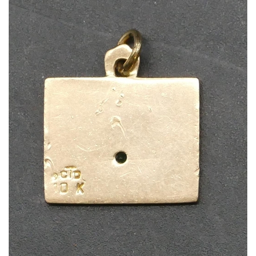 349 - A 10ct gold rectangular pendant, stamped FMC, with small emerald, 3.4 grams