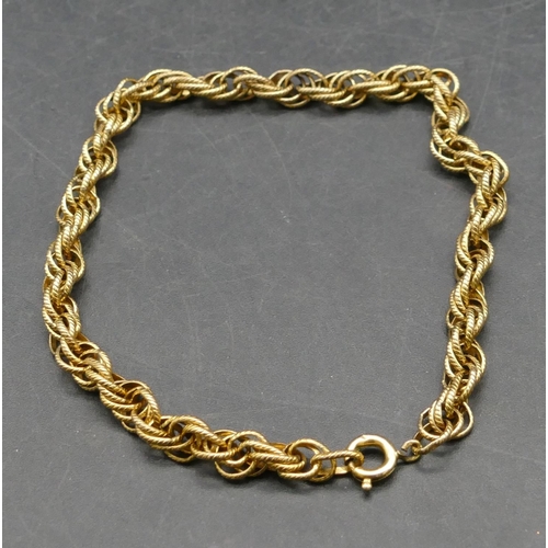 352 - A gold linked twist bracelet (plated clasp), 19.8cm long, 6.8 grams gross