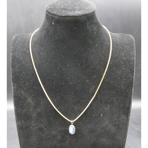 353 - A 9ct gold square snake linked necklace, 46cm long, mounted with moonstone pendant, 8.1 grams gross