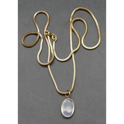 353 - A 9ct gold square snake linked necklace, 46cm long, mounted with moonstone pendant, 8.1 grams gross