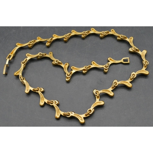 372 - A gilt metal and paste branch shaped necklace