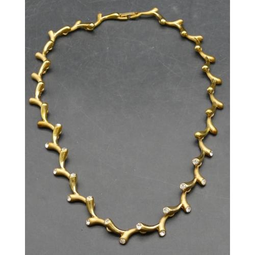 372 - A gilt metal and paste branch shaped necklace