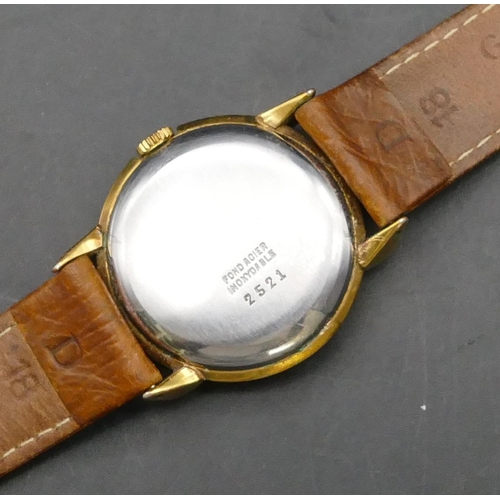 375 - Baume & Mercier, Geneva, gold plated circular wristwatch with seconds hand and leather strap