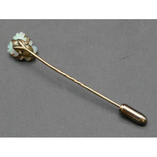 400 - A gold stickpin with Mother of Pearl top, inset with small diamond (cased), 2.3 grams gross