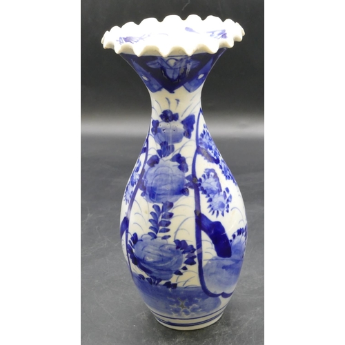 41 - A Japanese round bulbous thin necked trumpet shaped blue and white vase with crinkled rim and floral... 