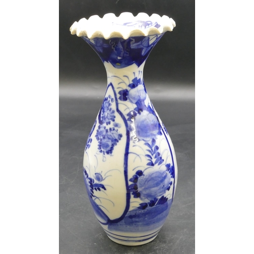 41 - A Japanese round bulbous thin necked trumpet shaped blue and white vase with crinkled rim and floral... 