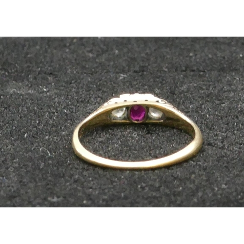 411 - A high carat gold ladies' 3 stone ring set with centre ruby flanked by 2 diamonds, Size N/O, 2.1 gra... 