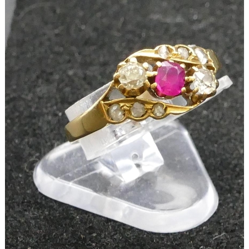 414 - A high carat gold 3 stone twist ring with centre ruby flanked by 2 diamonds, Size N, 2.9 grams gross