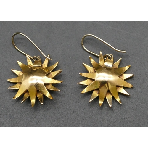 418 - A pair of 15ct gold starburst earrings mounted with half pearls, 6.9 grams gross