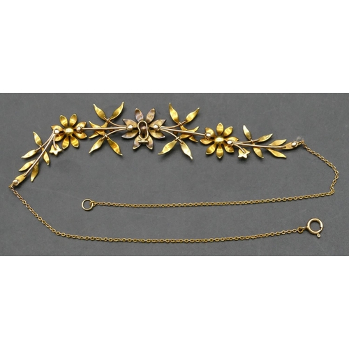 419 - A 15ct gold drop necklace with floral buds inset with half pearls, 41cm long, 16.3 grams gross