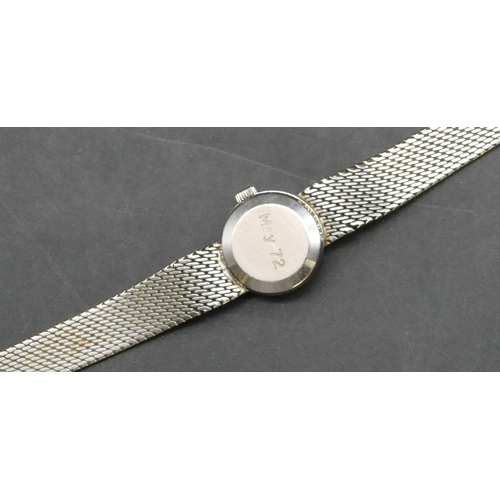 422 - A ladies' Omega 18ct white gold circular wristwatch with matching strap bracelet, overall weight 37.... 