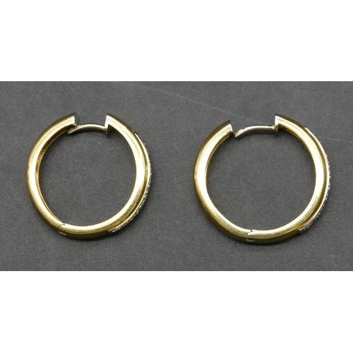 423 - A pair of 18ct gold circular hoop earrings, each inset with 11 diamonds, 2.6cm diameter, 9.3 grams g... 