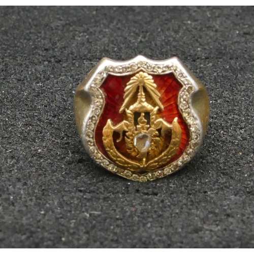 431 - An 18ct gold Masonic heavy shield shaped ring with red enamel decoration, set with various diamonds,... 