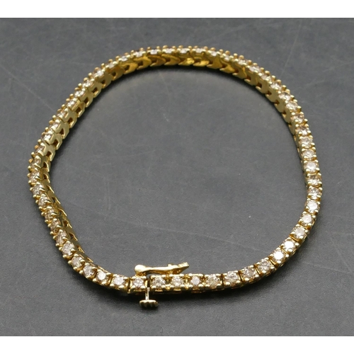 436 - A 14ct gold tennis bracelet set with 55 diamonds each approx. 0.08 carat, 17.5cm long, 10.5 grams gr... 