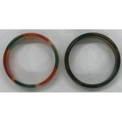 438 - 2 jade style hardstone bangles