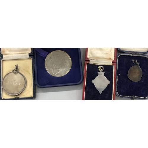 439 - A silver and enamelled swimming medal (boxed), 2 other silver medals (boxed) and a Fountain's Abbey ... 