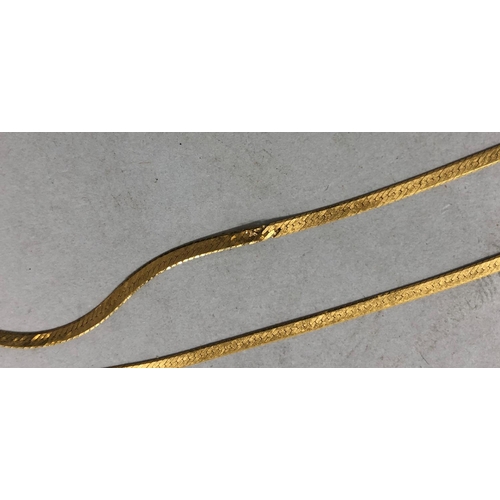 447 - A 9ct gold flat linked chain, 60.5cm long, 3 grams