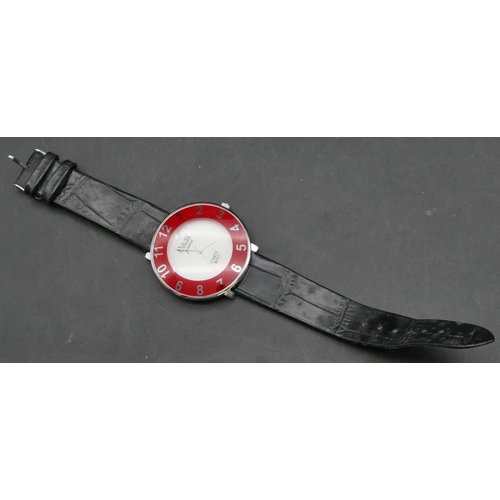 450 - A Pulse Femme Quartz circular wristwatch with red chapter ring and Arabic numerals, leather strap br... 