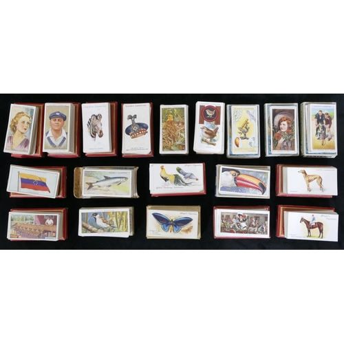 455 - A quantity of various cigarette cards - hats, flags, cinema stars, wild animal heads, dandies etc