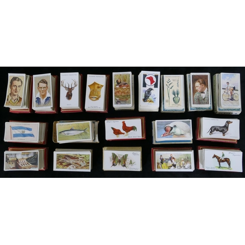 455 - A quantity of various cigarette cards - hats, flags, cinema stars, wild animal heads, dandies etc