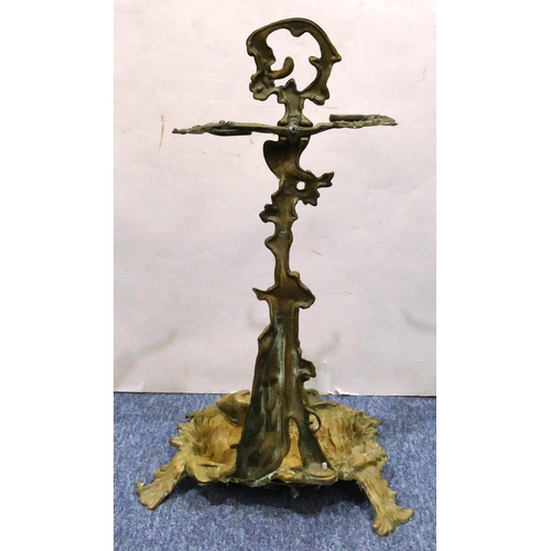 458 - A gilt metal umbrella stand with raised dog motif and hunting scene decoration on splayed feet, 56cm... 