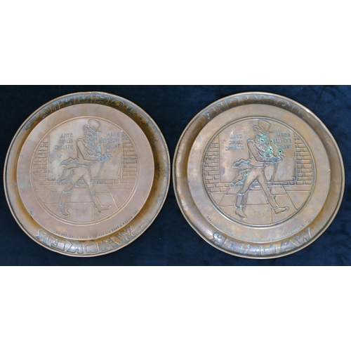 464 - 2 Johnnie Walker round copper whisky trays with embossed figure and inscription decoration, 33.5cm d... 