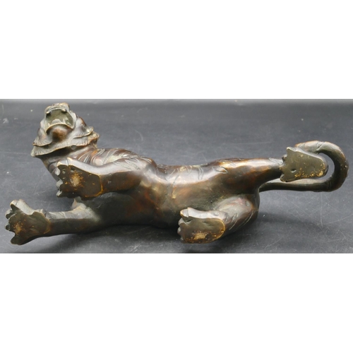 473 - A bronze figure of a tiger, 30cm long, 16cm high