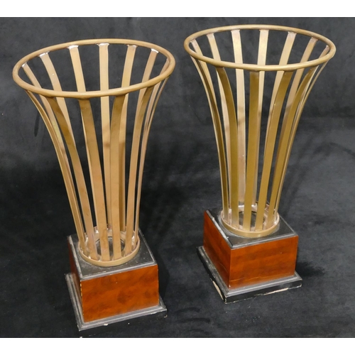 476 - A pair of modern brass round trumpet shaped pierced jardinières' on square walnut and ebonised bases... 