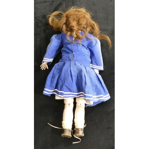 494 - A bisque headed child's doll, stamped E.R.T., with open eyes and mouth, jointed body in blue dress, ... 