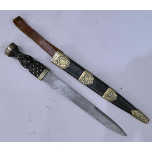 500 - A military Scottish dirk, blade stamped, with scabbard, 47cm long overall