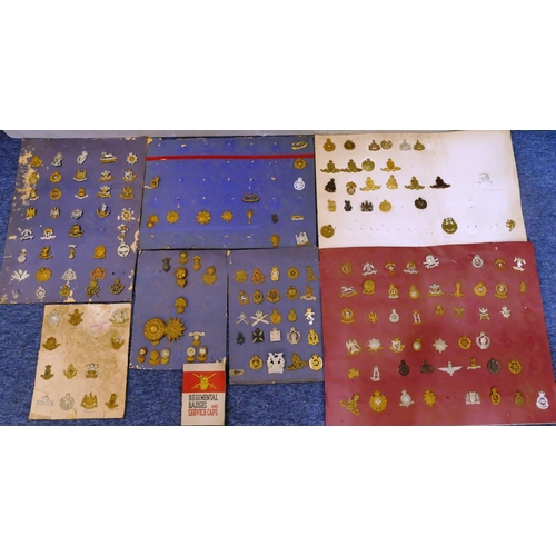 506 - 170 various military and other cap badges etc. mounted on 7 various boards