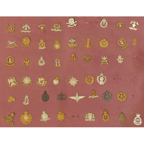 506 - 170 various military and other cap badges etc. mounted on 7 various boards