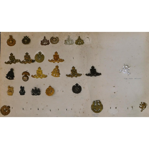 506 - 170 various military and other cap badges etc. mounted on 7 various boards