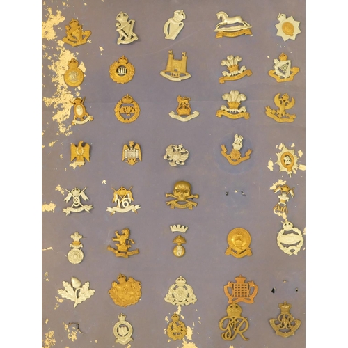 506 - 170 various military and other cap badges etc. mounted on 7 various boards