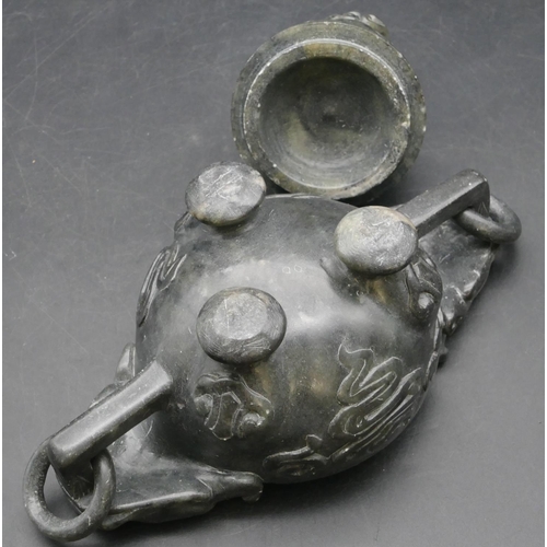 508 - An Oriental soapstone 2-handled bulbous shaped censer with cover and raised animal motif, 19.5cm wid... 