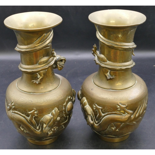 509 - A pair of Chinese gilt bronze round bulbous thin necked trumpet shaped vases with raised dragon moti... 