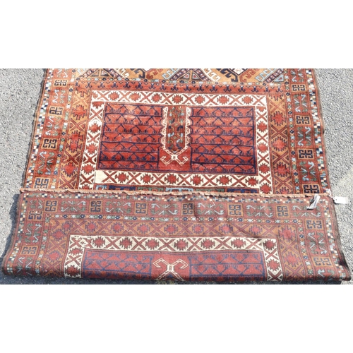 517 - A Persian rug on white, red and blue ground with various centre medallions, 189cm x 150cm